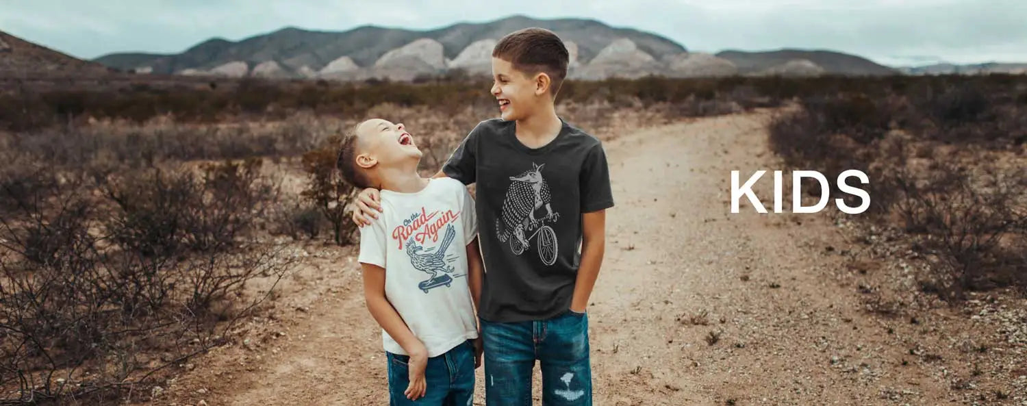 Two kids in a desert field